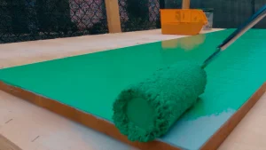 Painting acacia hard wood panel with 2 to 3 layers of green paint